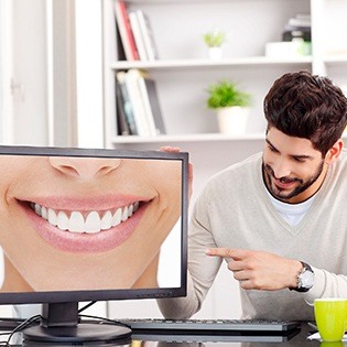 Man looking at smile design on computer