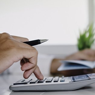 Man using a calculator