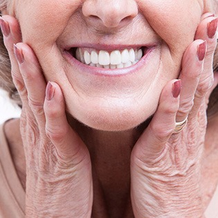 woman smiling with dentures in mouth