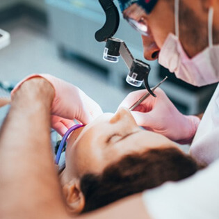 a dentist performing dental care on a patient