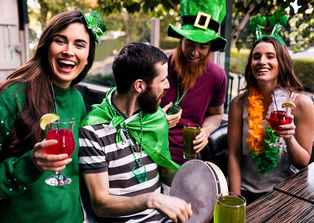 A lively group of individuals dressed in festive St. Patrick's Day costumes, celebrating with joy and enthusiasm.